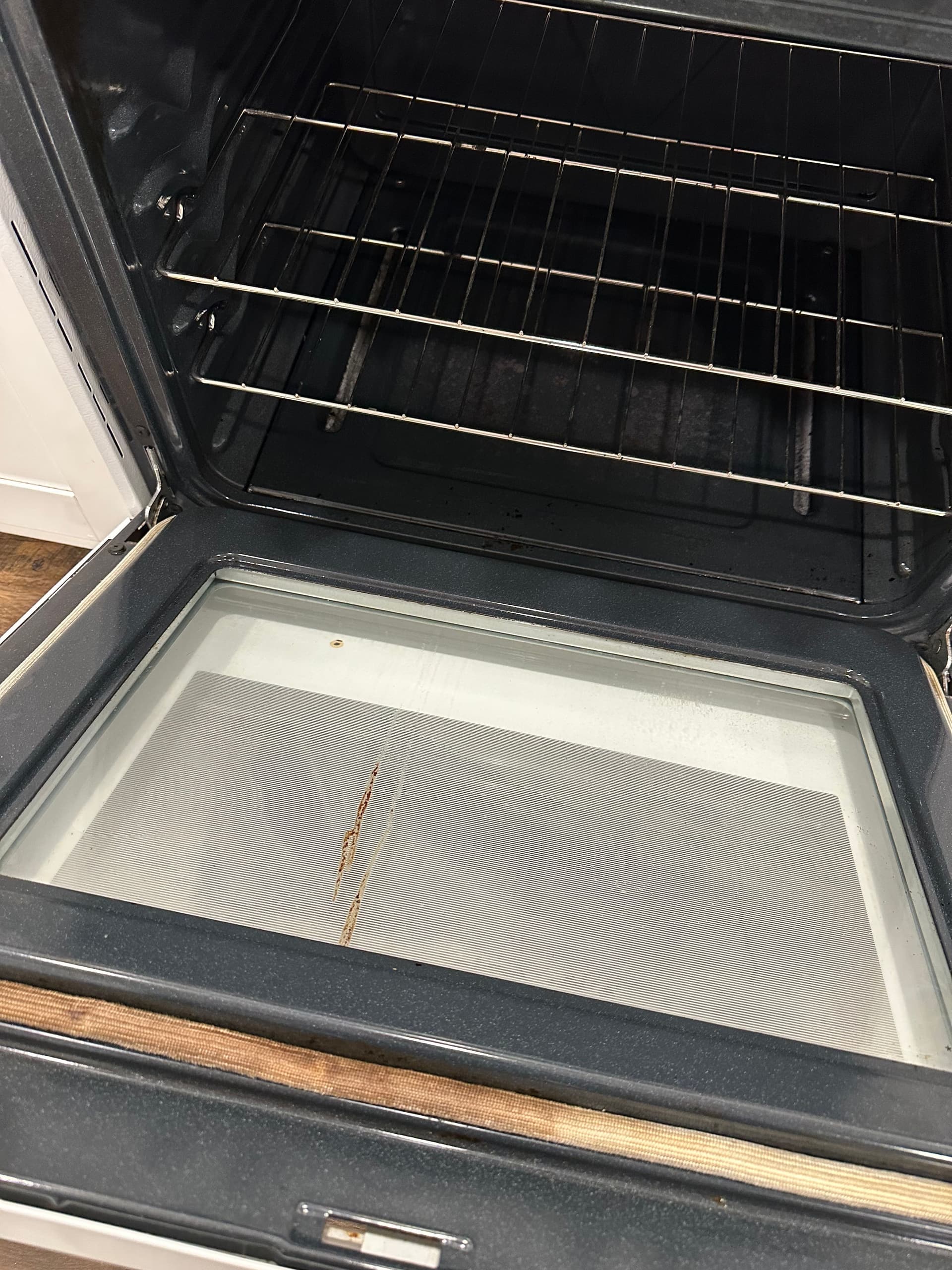 The same oven interior spotless after a deep clean